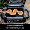 image:imageNinja XSKGRDPLT Woodfire Outdoor Flat Top Griddle Plate Compatible with Ninja Woodfire Grills OG700 series Ceramic Coating Insert BlackGrey  Ninja Woodfire Griddle Plate clicks into your grill for even edgetoedge searing and easyclean nonstick cooking146 x 11 x 22
